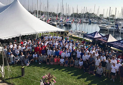 competitors gather for a group shot while waiting for wind